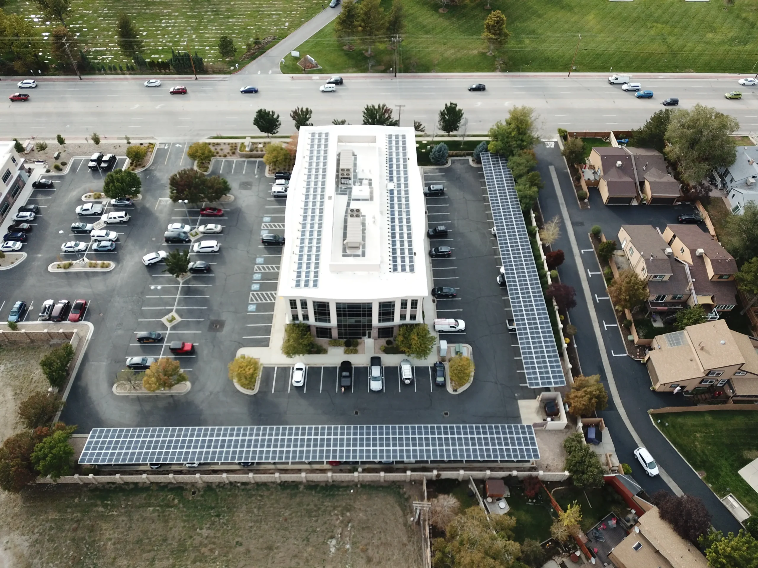Aerial view of rooftop solar panels and solar carports surrounding the ALD Offices.